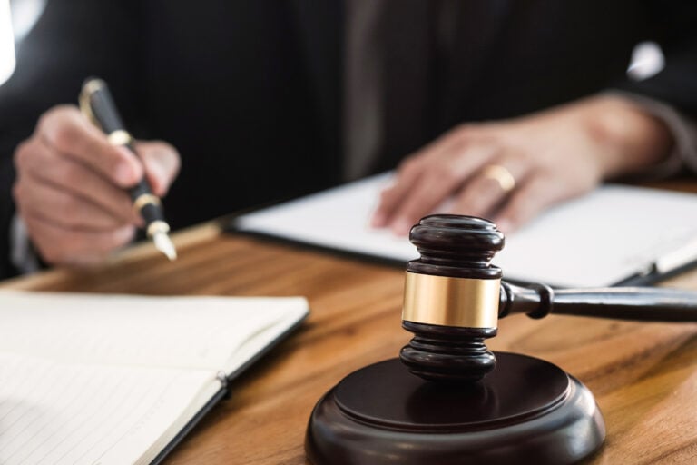 ,Judge,Gavel,Working,With,Legal,Documents,In
