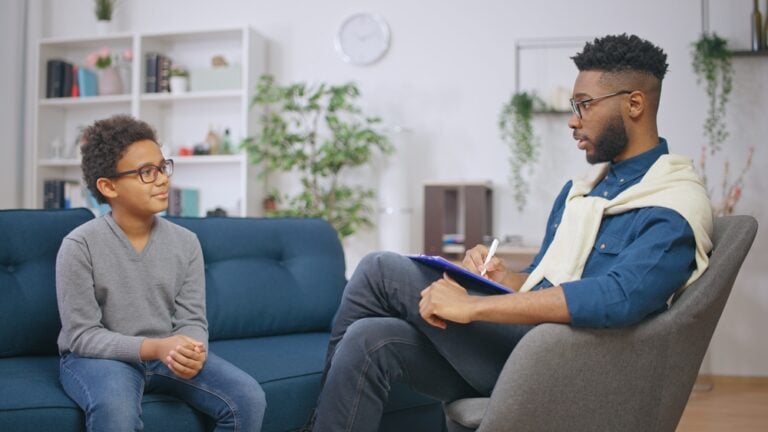 Case Management Software for social work - image of a social worker and kid