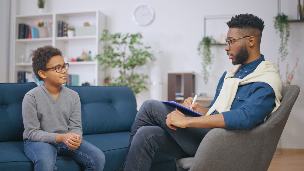 Case Management Software for social work - image of a social worker and kid