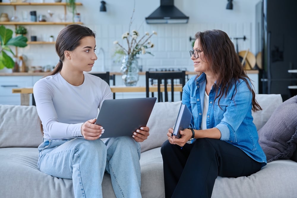 Worker model - image of a social worker with a teenager