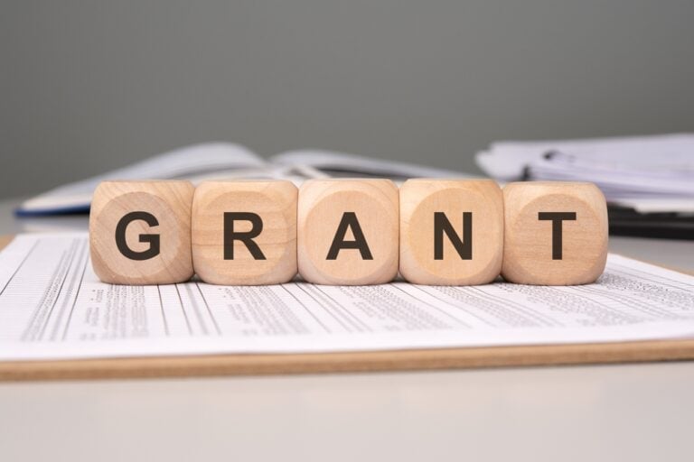 grant reporting - image of blocks spelling grant